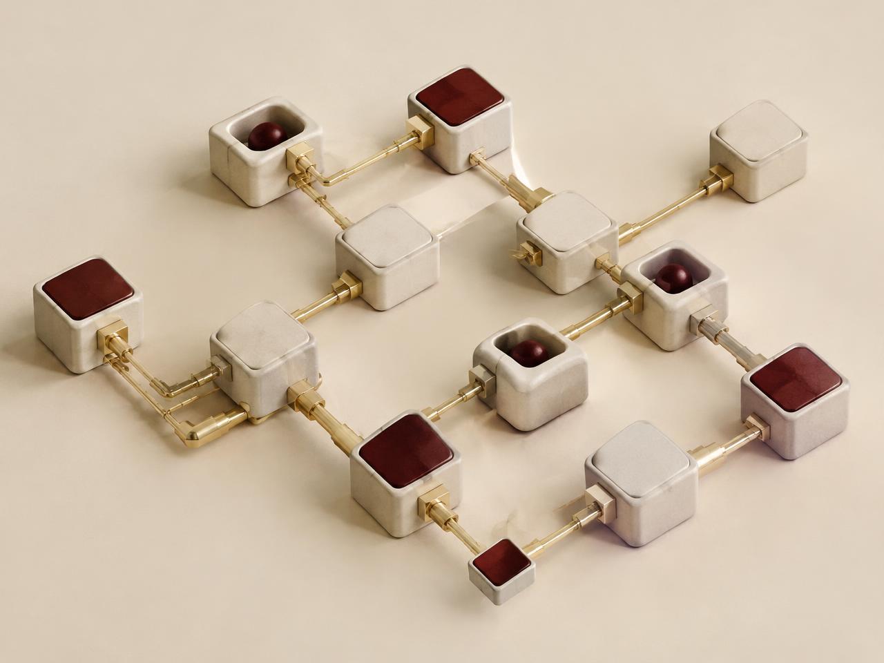 Network of ceramic blocks joined by brass connectors